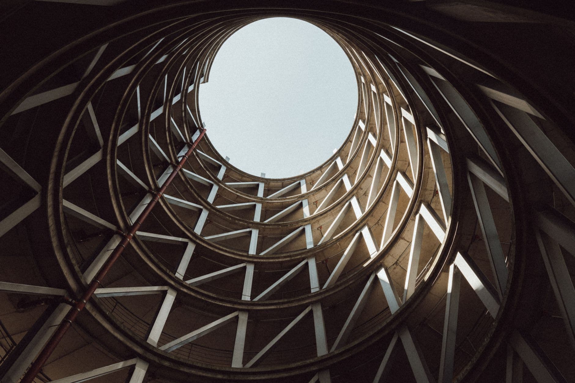 Striking view inside a spiral parking garage showcasing abstract geometric design.