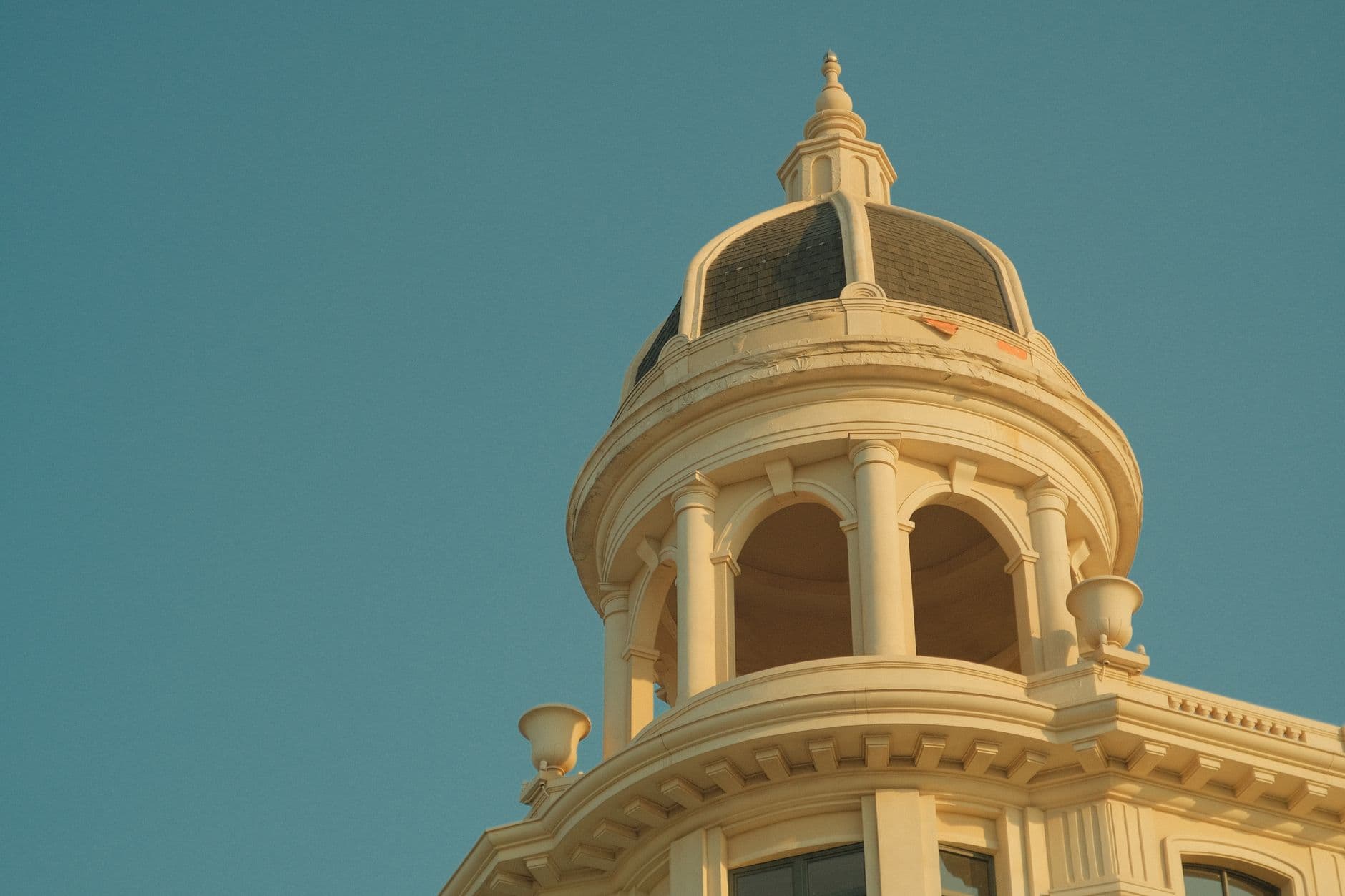 A beautifully detailed dome against a clear blue sky, capturing classic architectural style.