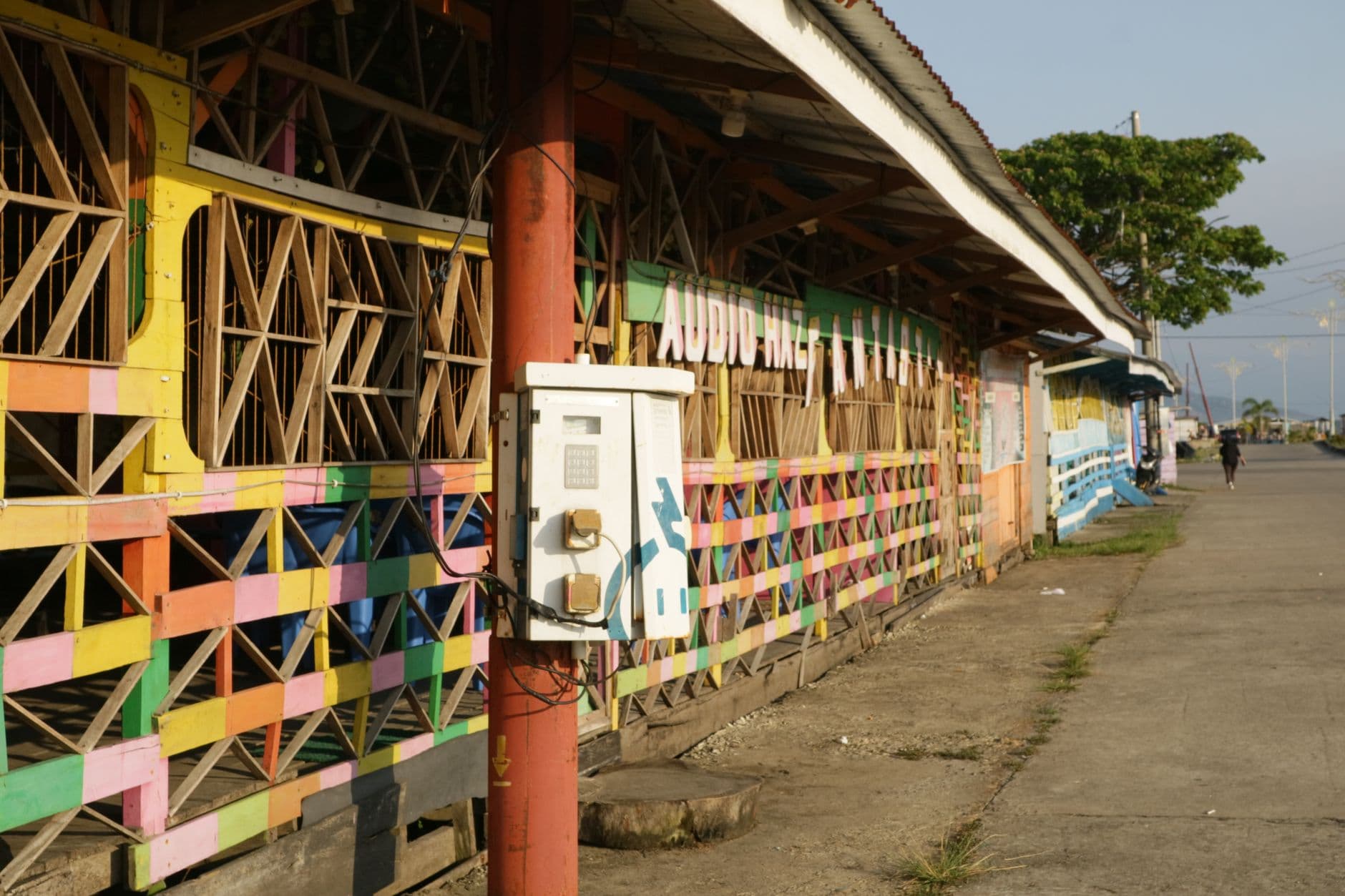 Vibrant wooden building facade in Sulawesi Selatan, Indonesia, showcasing colorful geometric patterns.