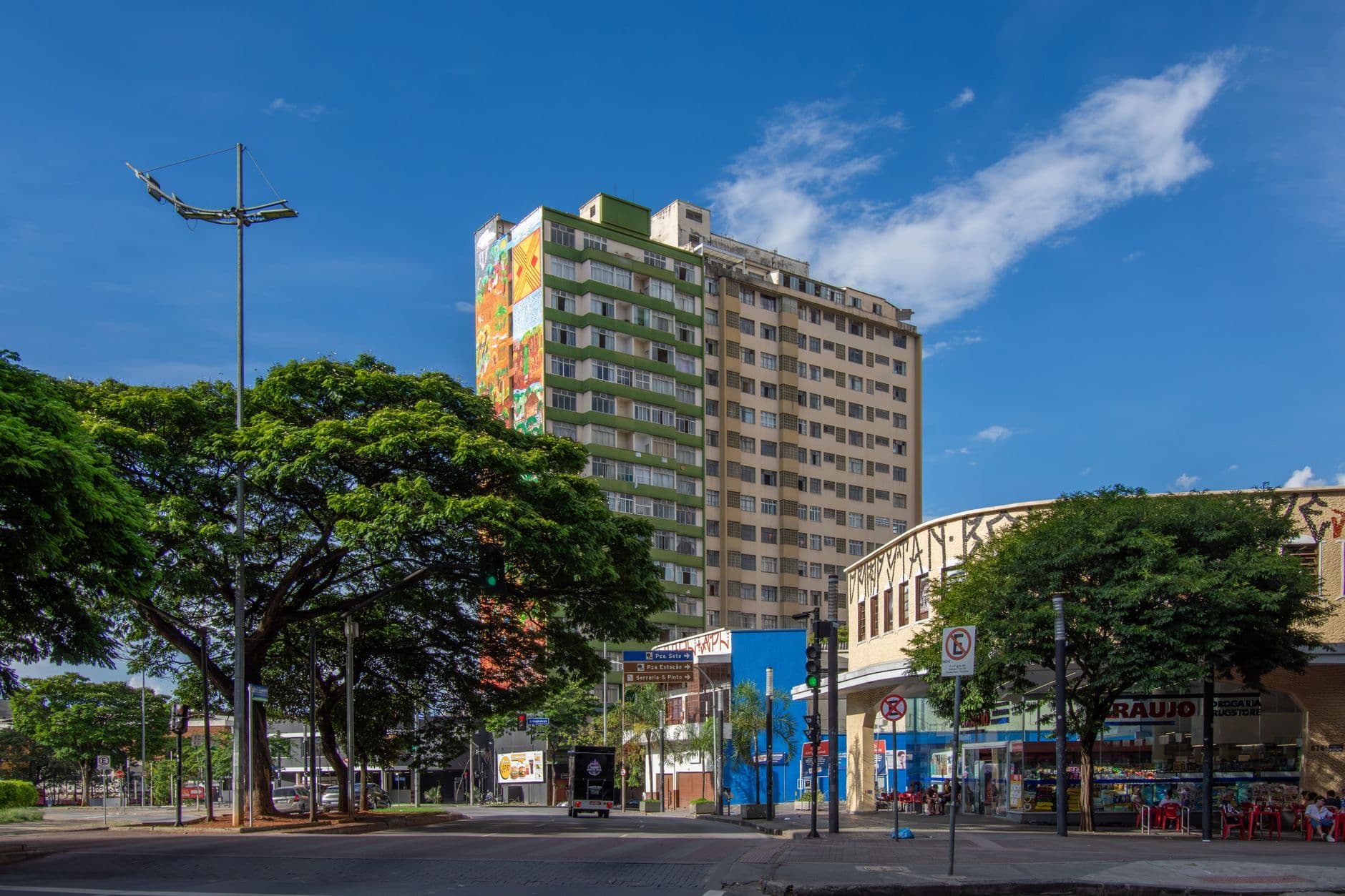Colorful building in Belo Horizonte, Brazil, under a clear blue sky, capturing urban life.