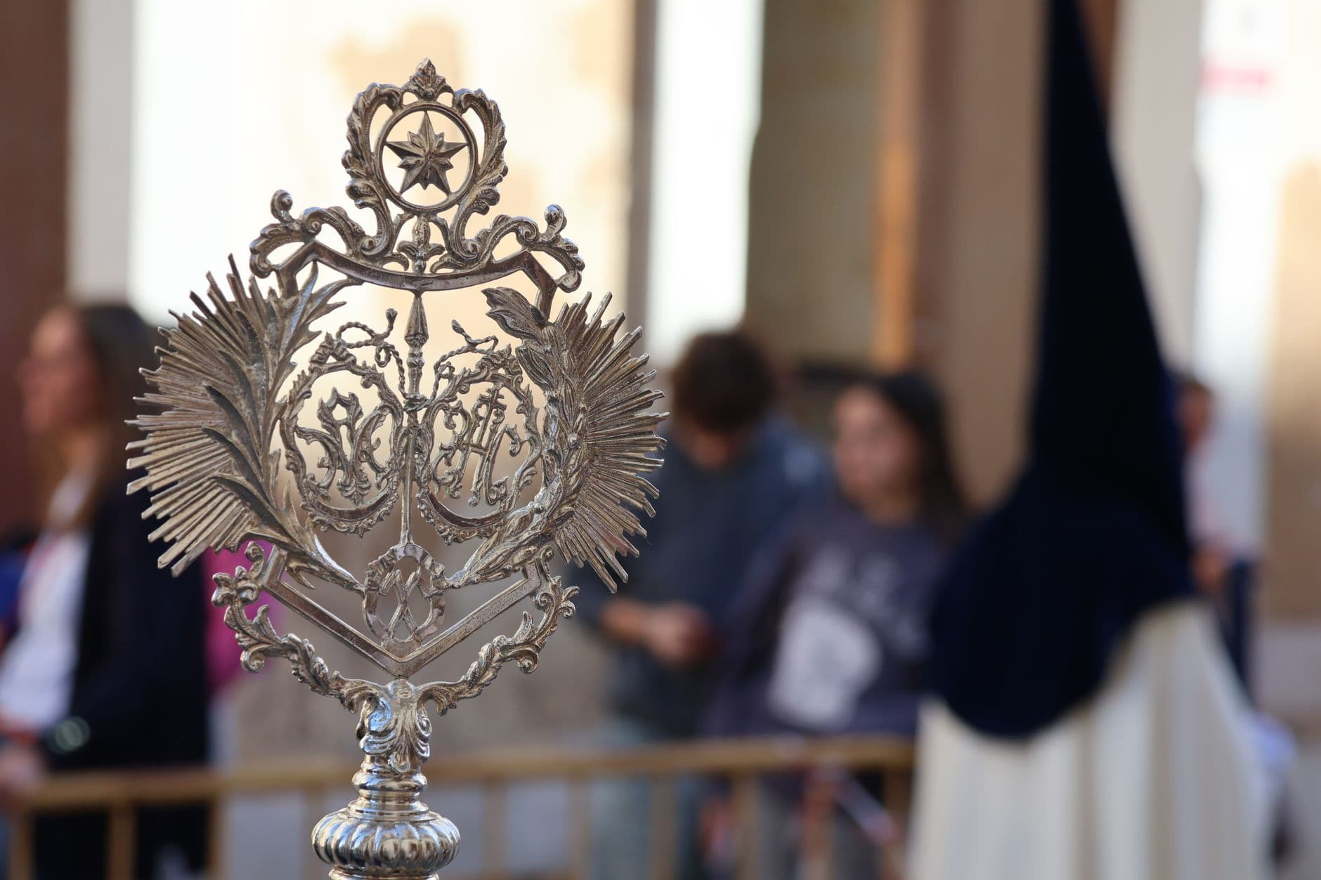 Close-up of an ornate religious symbol during Semana Santa procession in El Puerto de Santa María, Spain.