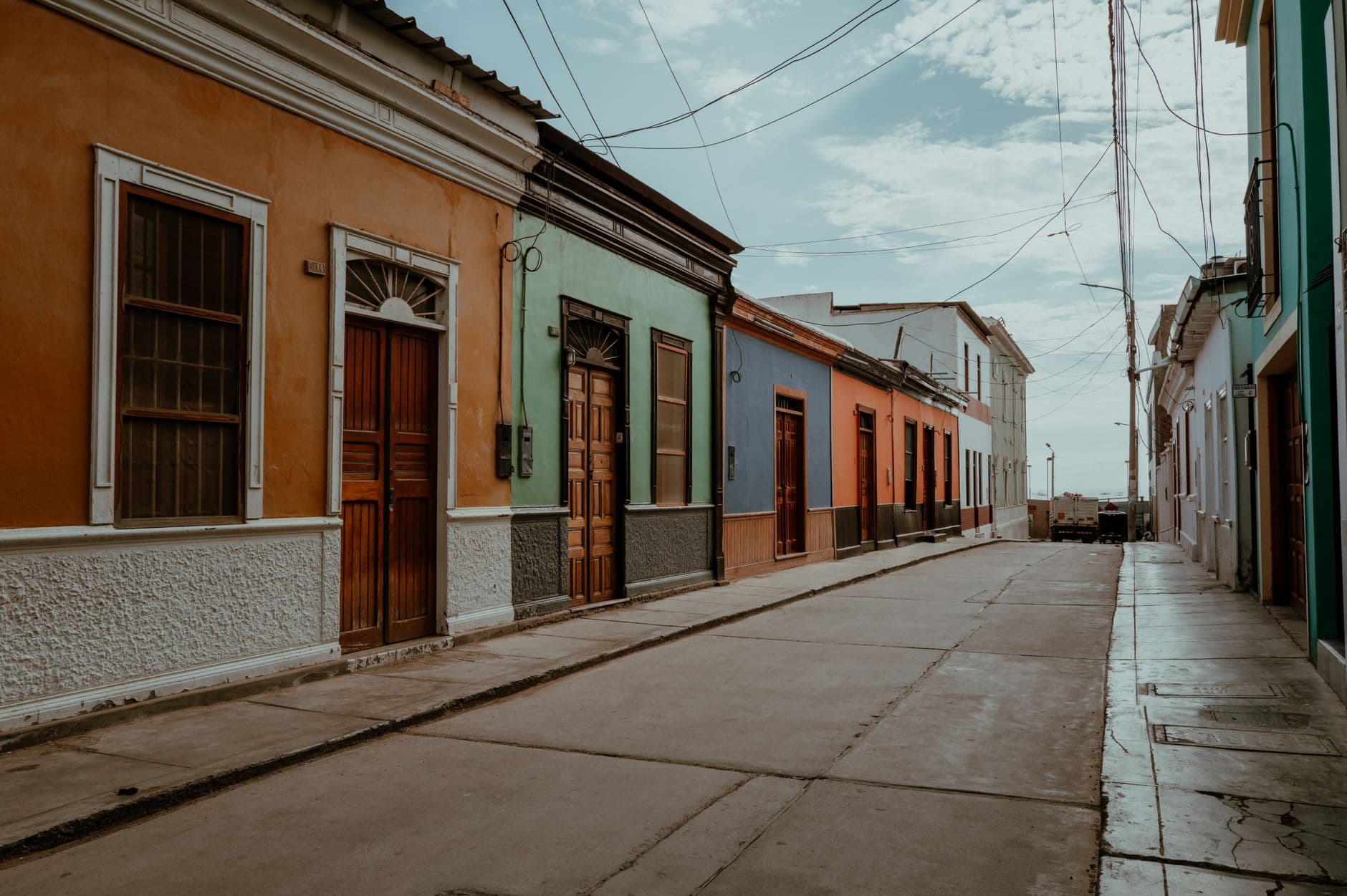 Explore the vibrant architecture of Pacasmayo's streets, showcasing colorful facades and classic style.