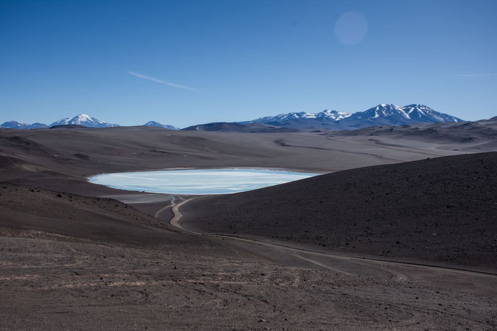 Expansive mountain landscape with rugged terrain and snow-capped peaks in Catamarca, Argentina.