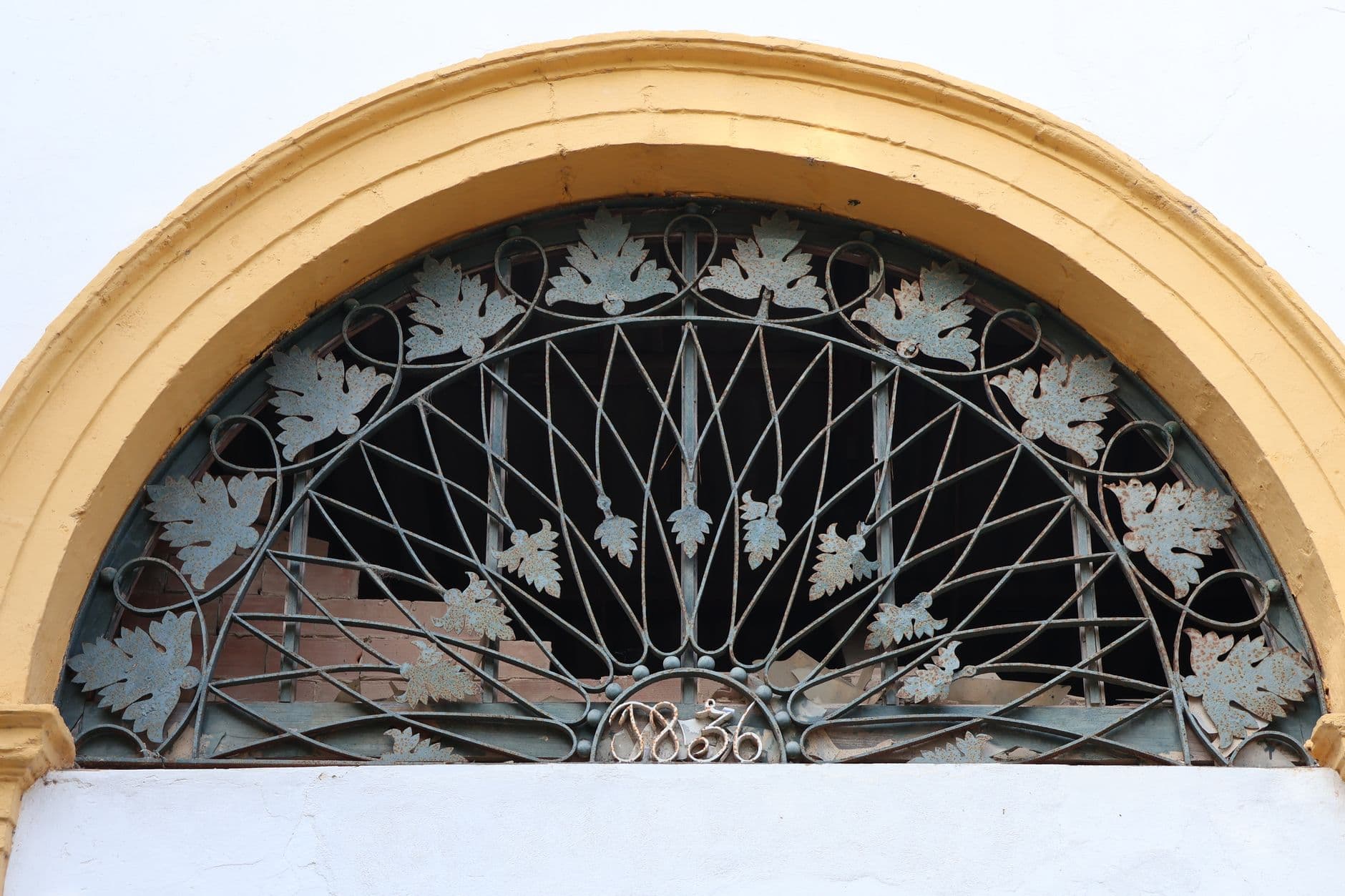 Detail of an ornate iron window grille from 1836 in El Puerto de Santa María.