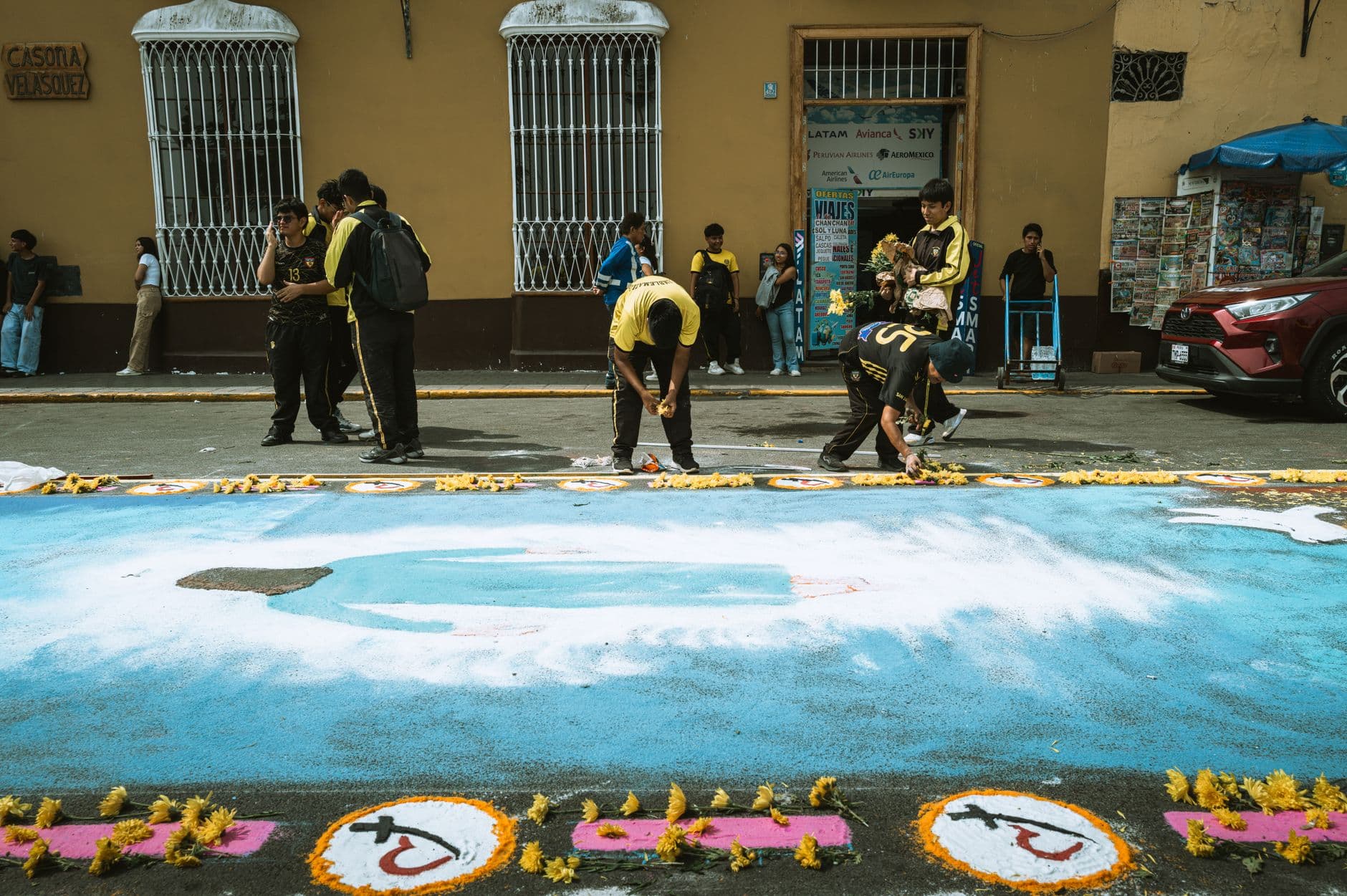Young artists create colorful street art for a festival in Trujillo, Peru.