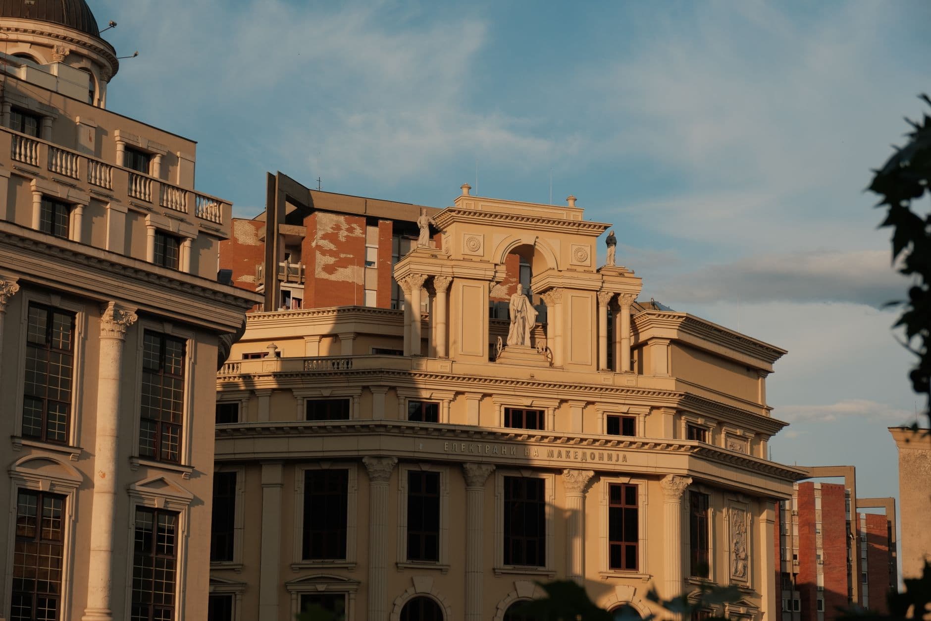 Stunning view of historic architecture in Skopje, North Macedonia, bathed in golden sunset light.