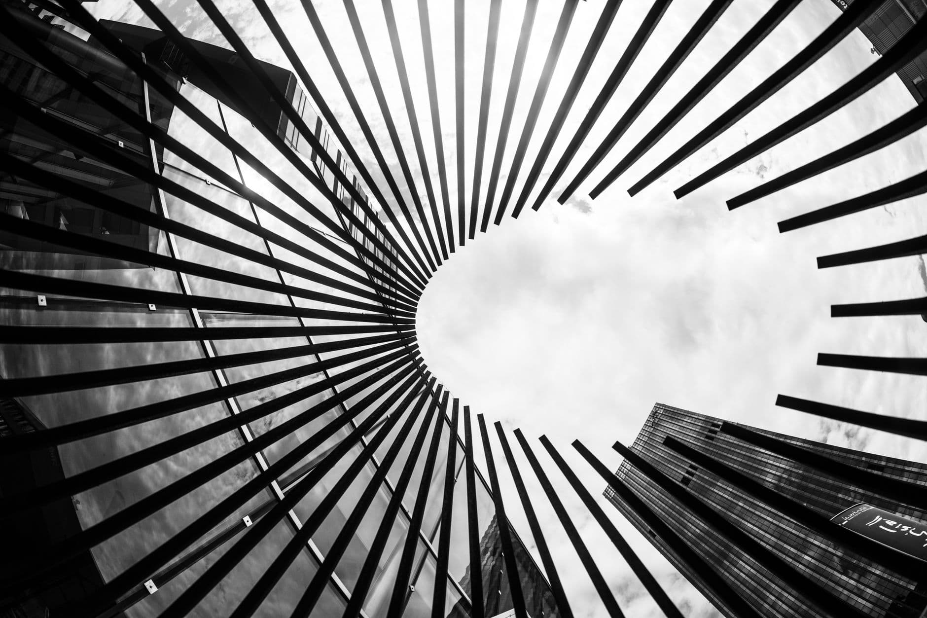 Black and white abstract view of architectural structure against the cloudy sky in Vienna, Austria.