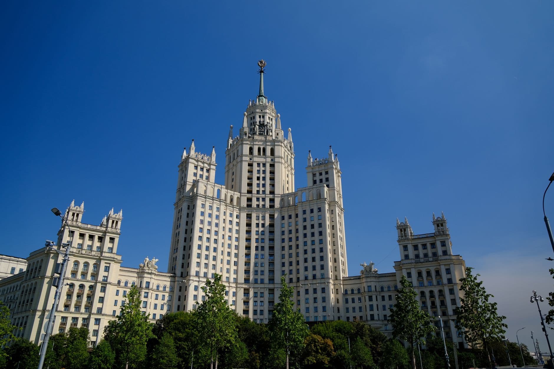 A striking example of Stalinist architecture with a clear blue sky background.