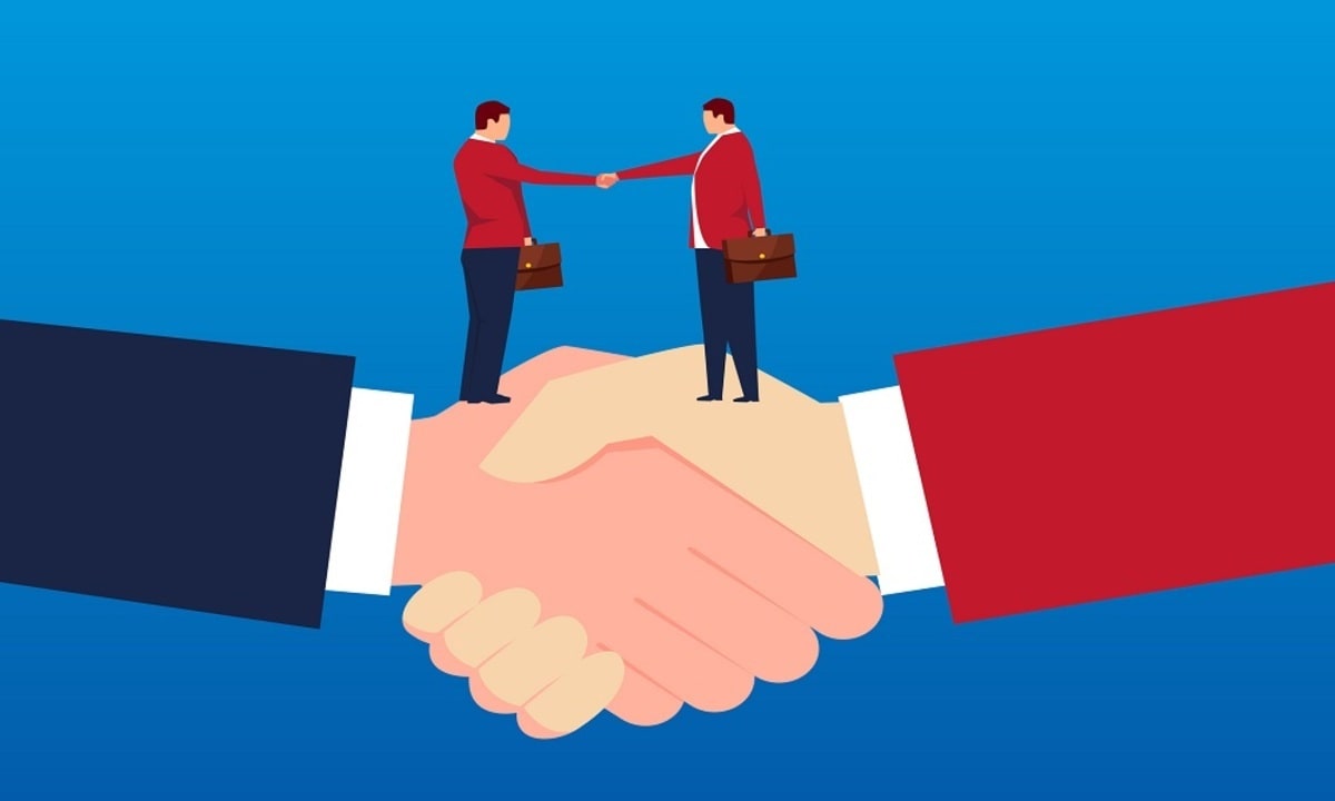 Two businessmen holding hands